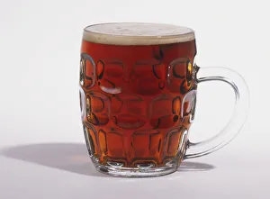 Bitter served in a half-pint glass tankard Bitter served in a half-pint glass tankard