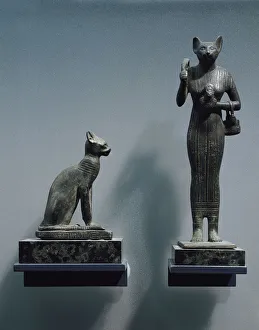 Bronze figurines of goddess Bastet, as a cat or a cat-headed woman Bronze figurines of goddess Bastet, as a cat or a cat-headed woman