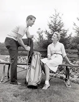 Couple taking a break from playing golf Couple taking a break from playing golf