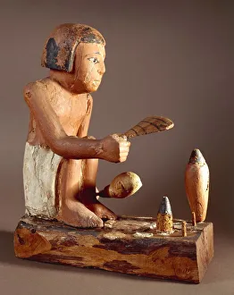 Egypt, Asyut, Statuette representing a cook trying to roast a duck Egypt, Asyut, Statuette representing a cook trying to roast a duck