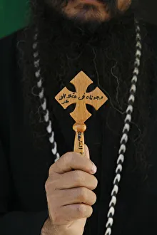 Egyptian orthodox coptic priest showing cross Egyptian orthodox coptic priest showing cross