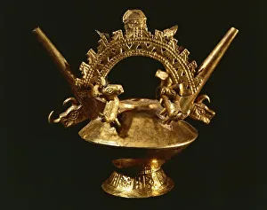 Embossed gold double spout and bridge vessel decorated with zoomorphic Embossed gold double spout and bridge vessel decorated with zoomorphic