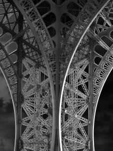 Eiffel Tower Construction Prints: The Eiffel Tower: detail and sky bw
