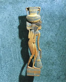 Figurine of naked woman holding vase for ointments and sack of lily petals Figurine of naked woman holding vase for ointments and sack of lily petals