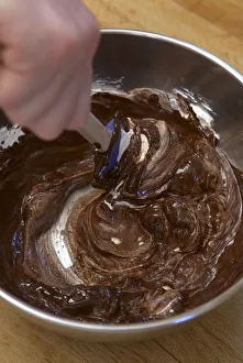Folding in egg whites to a chocolate and butter mixture Folding in egg whites to a chocolate and butter mixture