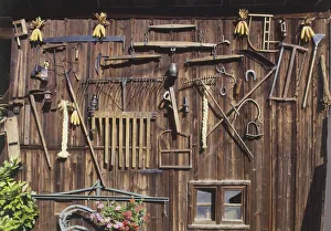 France, Alsace, Eguisheim, wine growers courtyard, tools hung on wood France, Alsace, Eguisheim, wine growers courtyard, tools hung on wood