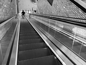 Going down an escalator in Westgate, Oxford bw Going down an escalator in Westgate, Oxford bw
