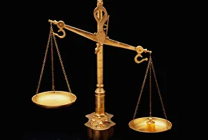 Golden Scales of Justice Unbalanced Print. Art Prints, Posters & Puzzles  from Universal Images Group