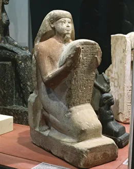 Gres statue of Nefferenpet holding stele Gres statue of Nefferenpet holding stele