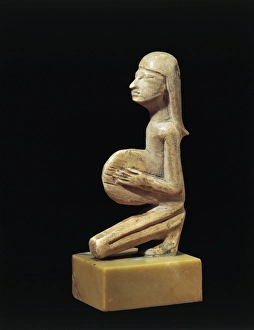 Hippopotamus ivory statue of a tambourine player from Syria Hippopotamus ivory statue of a tambourine player from Syria