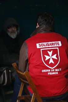 Homeless person with a Malta Order volunteer Homeless person with a Malta Order volunteer