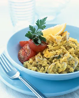 Kedgeree traditionally incorporates smoked fish and in this recipe haddock has been used, served with grilled tomatoes Kedgeree traditionally incorporates smoked fish and in this recipe haddock has been used, served with grilled tomatoes