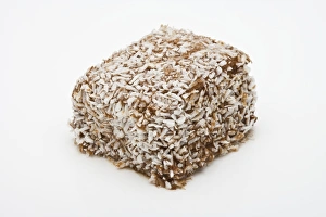 Lamington sponge cake covered with cococnut Lamington sponge cake covered with cococnut