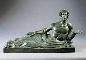 Lid of a cinerary urn with a portrait of a reclining young man, 400/375 B.C. bronze Lid of a cinerary urn with a portrait of a reclining young man, 400/375 B.C. bronze