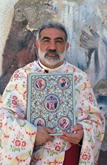 Melkite priest Emile Shoufani holding the new testament Melkite priest Emile Shoufani holding the new testament