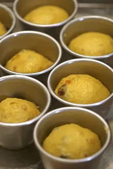 Mini panettones in moulds before baking Mini panettones in moulds before baking