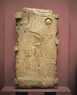 Painted limestone slab with relief depicting Akhenaton, Nefertiti and daughters worshipping the god Aton from New Painted limestone slab with relief depicting Akhenaton, Nefertiti and daughters worshipping the god Aton from New