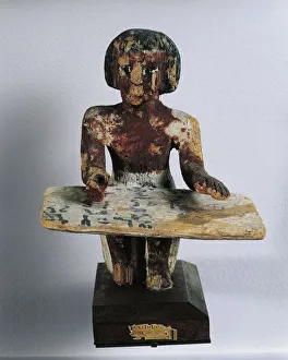 Painted wood statue of scribe Intef recording wheat harvest Painted wood statue of scribe Intef recording wheat harvest