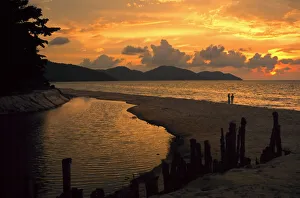 Two people on Ferenghi beach at sunset, Penang Malaysia 3 Two people on Ferenghi beach at sunset, Penang Malaysia 3