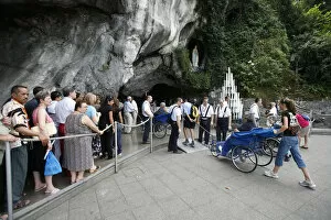 Images Dated 20th April 2000: Pilgrims at the Lourdes grotto