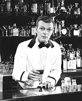 Portrait of a bartender holding a drink Portrait of a bartender holding a drink
