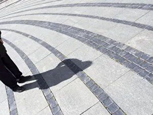 Shadows in the Piazza de Ferrari in Genoa, Italy Shadows in the Piazza de Ferrari in Genoa, Italy
