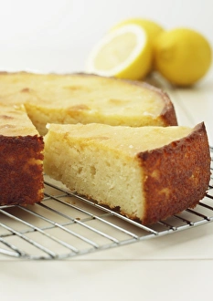 Slice of sticky lemon cake on cooling rack, close-up Slice of sticky lemon cake on cooling rack, close-up