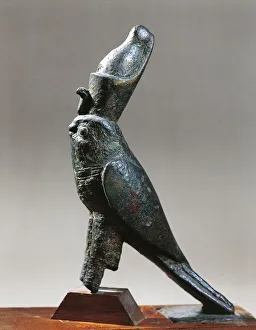 Statuette representing the Falcon god, Horus wearing the double crown, bronze Statuette representing the Falcon god, Horus wearing the double crown, bronze