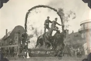 Prints of Photo of two men standing on horseback riding through a ring of fire Vintage Postcard Prints: Equestrian Event Print of Two Men Riding Horses Through a Ring of Fire