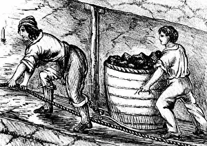 Woman and boy underground in coal mine drawing cart containing 3-4 cwt of coal - Bolton, Lancashire Woman and boy underground in coal mine drawing cart containing 3-4 cwt of coal - Bolton, Lancashire