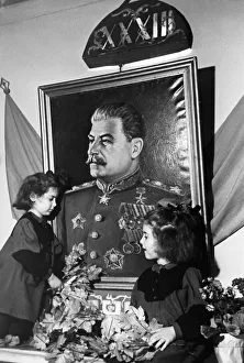 Two young girls at a kindergarten in the sverdlov district of moscow adorning a portrait Two young girls at a kindergarten in the sverdlov district of moscow adorning a portrait
