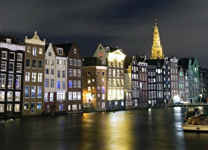 Amsterdam canal facing houses and Old church spire Amsterdam canal facing houses and Old church spire