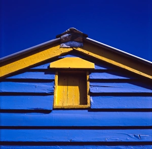 Blue and yellow painted building under blue sky Blue and yellow painted building under blue sky