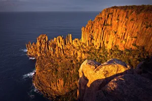 Cape Raoul`s sea cliffs of Dolerite at sunrise, Tasman National Park, Tasmania, Australia Cape Raoul`s sea cliffs of Dolerite at sunrise, Tasman National Park, Tasmania, Australia
