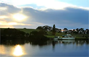 Dawn breaking though the clouds on the Nicholson river, east Gippsland, Victoria Dawn breaking though the clouds on the Nicholson river, east Gippsland, Victoria