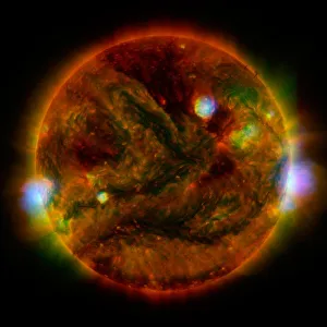 Prints of Flaring, active regions of our sun are highlighted in this image combining observations from several telescopes Images Dated 2019 April: Sun Flare Print