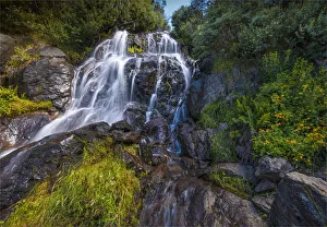 Flowing water over Falls Creek waterfall in the Alpine mountainous region of north east Victoria, Australia Flowing water over Falls Creek waterfall in the Alpine mountainous region of north east Victoria, Australia