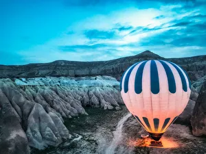 A hot air balloon is preparing to fly A hot air balloon is preparing to fly
