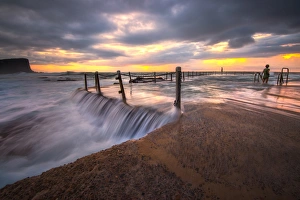 Magnificent sunrise and stunning colour over Avalon rock pool Magnificent sunrise and stunning colour over Avalon rock pool