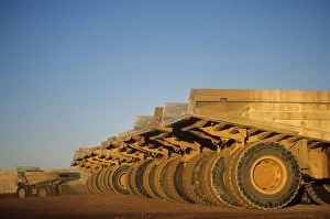 Ore hauling trucks in row, Telfer, Western Australia Ore hauling trucks in row, Telfer, Western Australia
