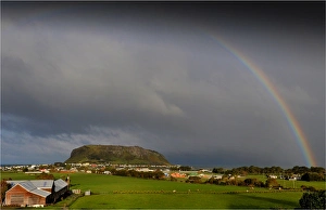 Rainbow appearing over Circular head at Stanley, in the northern area of the island state, Tasmania, Australia Rainbow appearing over Circular head at Stanley, in the northern area of the island state, Tasmania, Australia