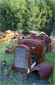Rusting derelict old car parts in a farmyard, Flinders Island, Tasmania Rusting derelict old car parts in a farmyard, Flinders Island, Tasmania
