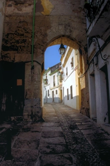 Seville old town narrow passage and white building Seville old town narrow passage and white building