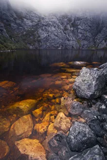 The shore of Square Lake on a misty afternoon in the Western Arthur Range The shore of Square Lake on a misty afternoon in the Western Arthur Range