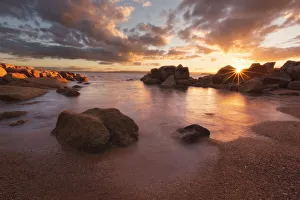 Sunset over a secluded beach in Coles Bay, Freycinet national Park, Tasmania, Australia Sunset over a secluded beach in Coles Bay, Freycinet national Park, Tasmania, Australia