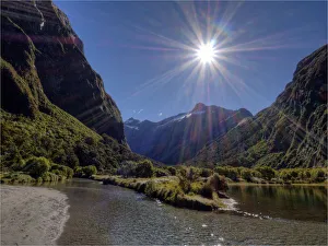 Sunstar shining on the Clinton river, South Island, New Zealand Sunstar shining on the Clinton river, South Island, New Zealand