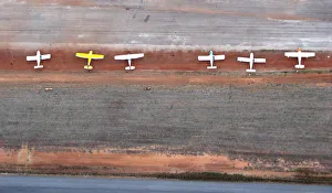 White Planes on Red Dirt Airstrip from Above White Planes on Red Dirt Airstrip from Above