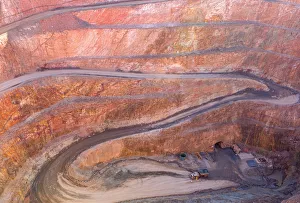 Winding Road down to the entry of a Gold Mine with a dump truck Winding Road down to the entry of a Gold Mine with a dump truck