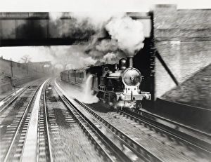 The London & North Western Railway locomotive Jeanie Deans picking up water at Bushey The London & North Western Railway locomotive Jeanie Deans picking up water at Bushey