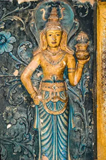 18th century frescoes and statues of Buddhism at entrance to shrine at Dambadeniya Temple 18th century frescoes and statues of Buddhism at entrance to shrine at Dambadeniya Temple